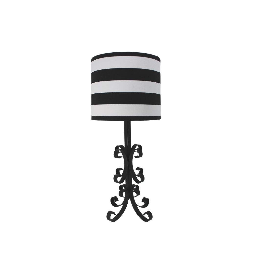Black wrought iron table lamp with striped shade.