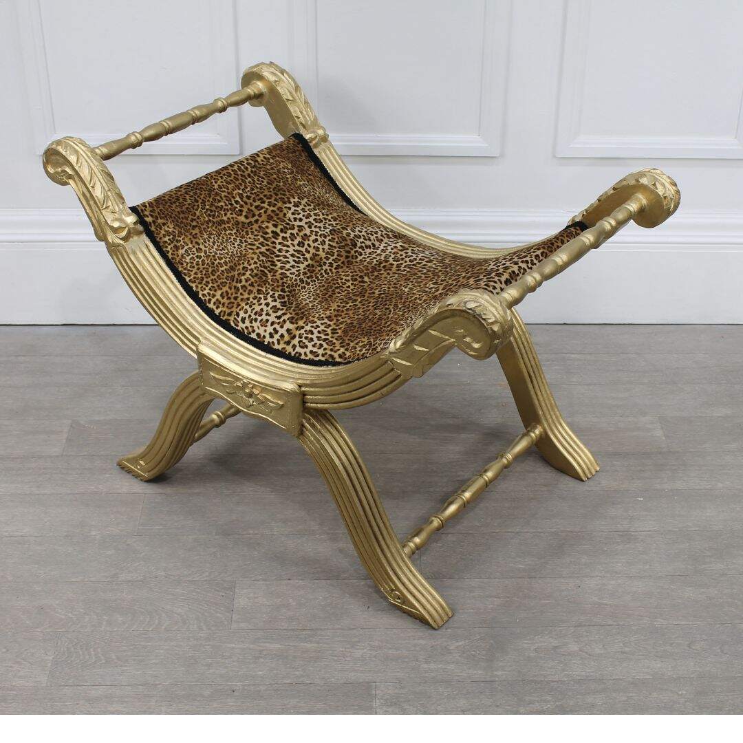 Gold sling bench with leopard print fabric