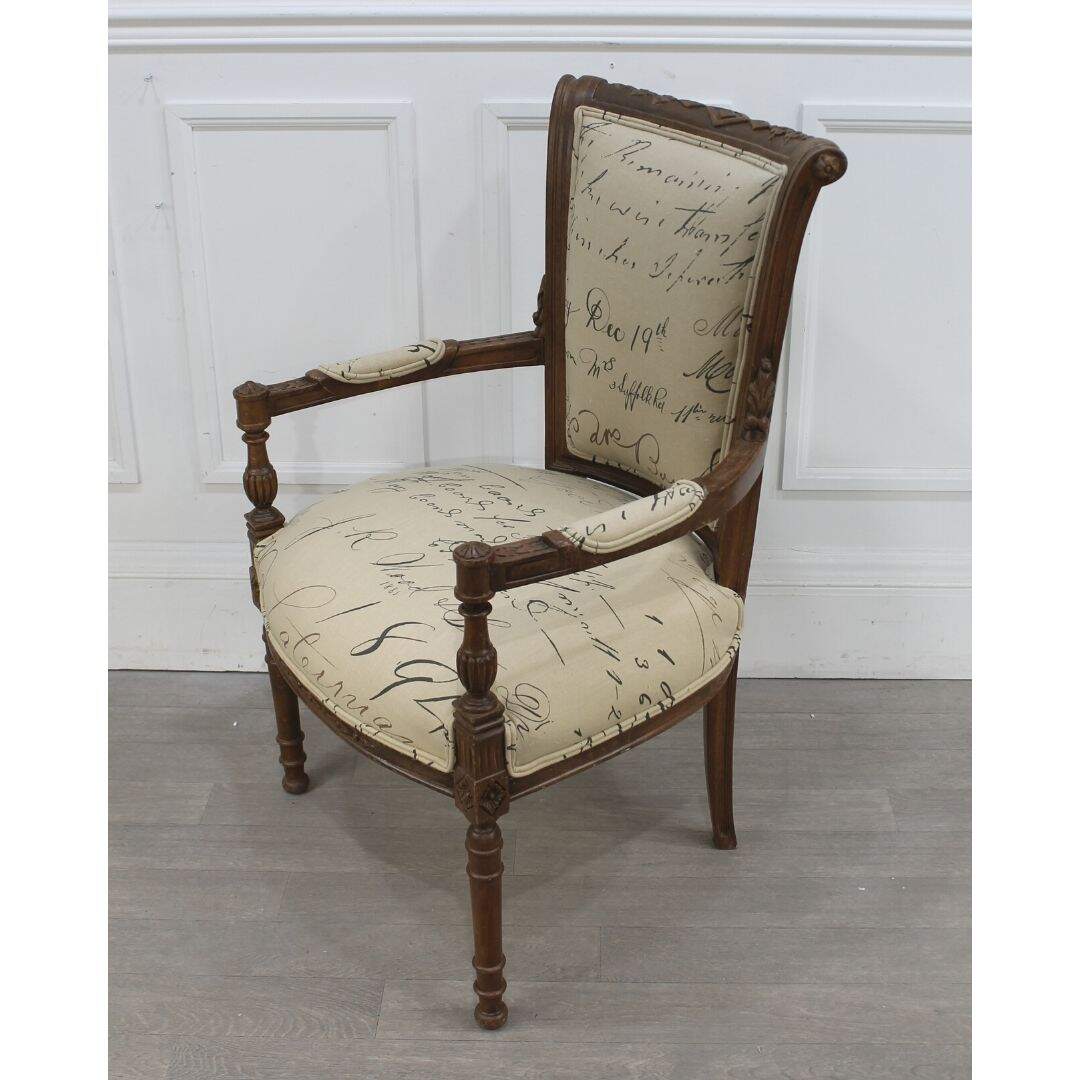 Pair of carved wood armchairs with script fabric
