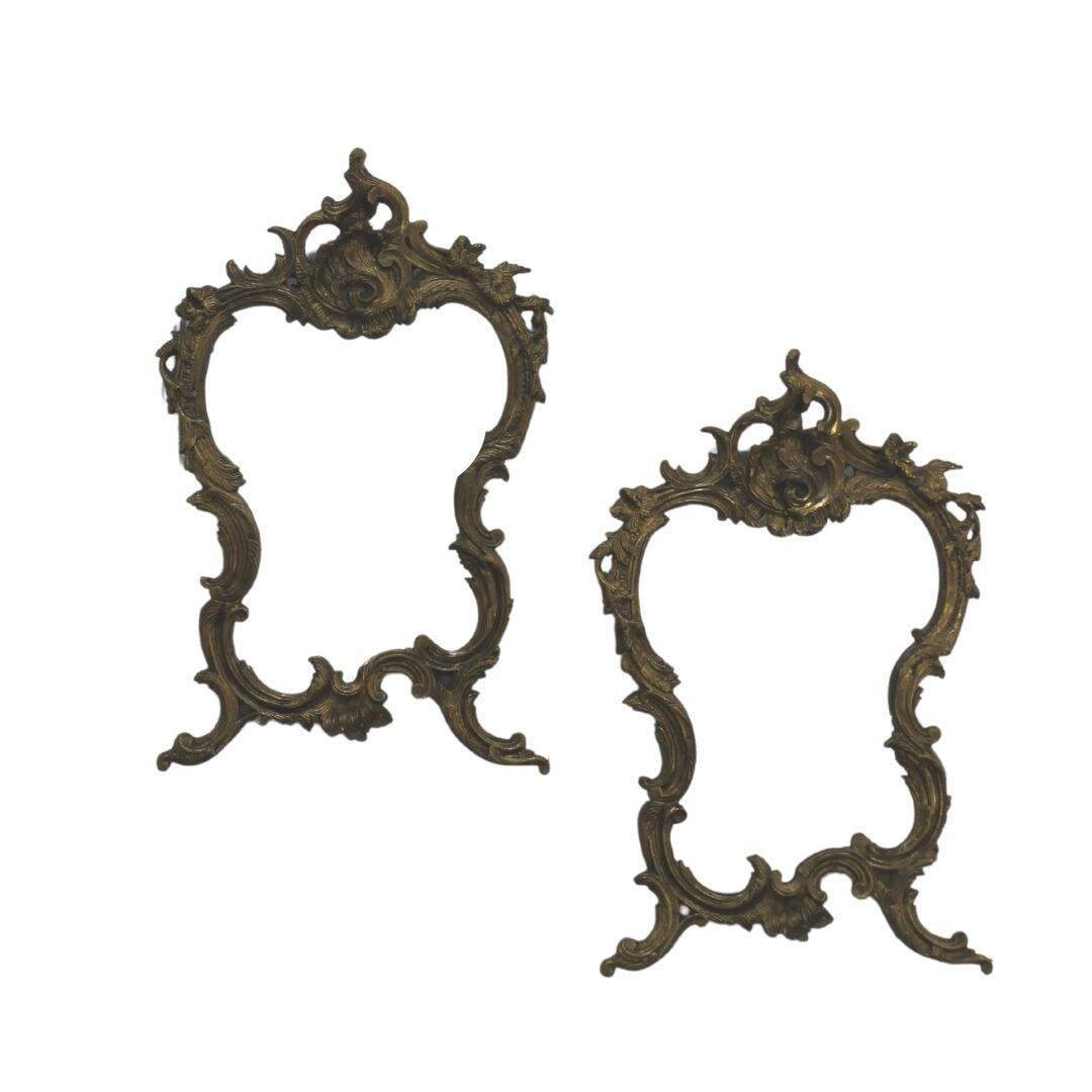 Pair of ornate cast metal mirrors
