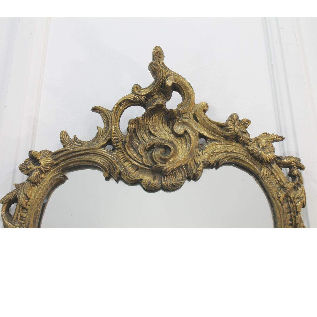Pair of ornate cast metal mirrors
