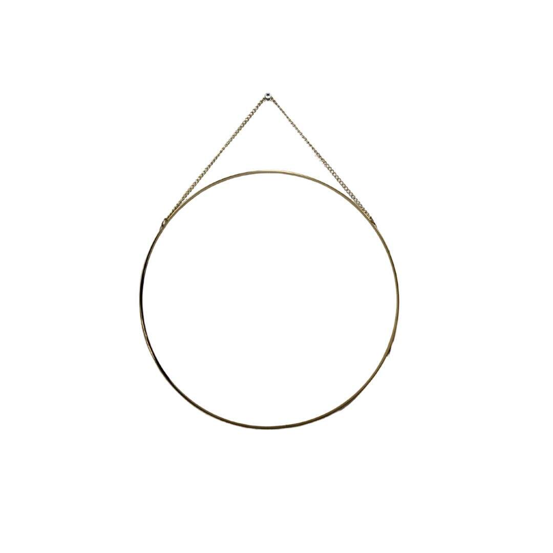 round mirror with thin gold frame and chain